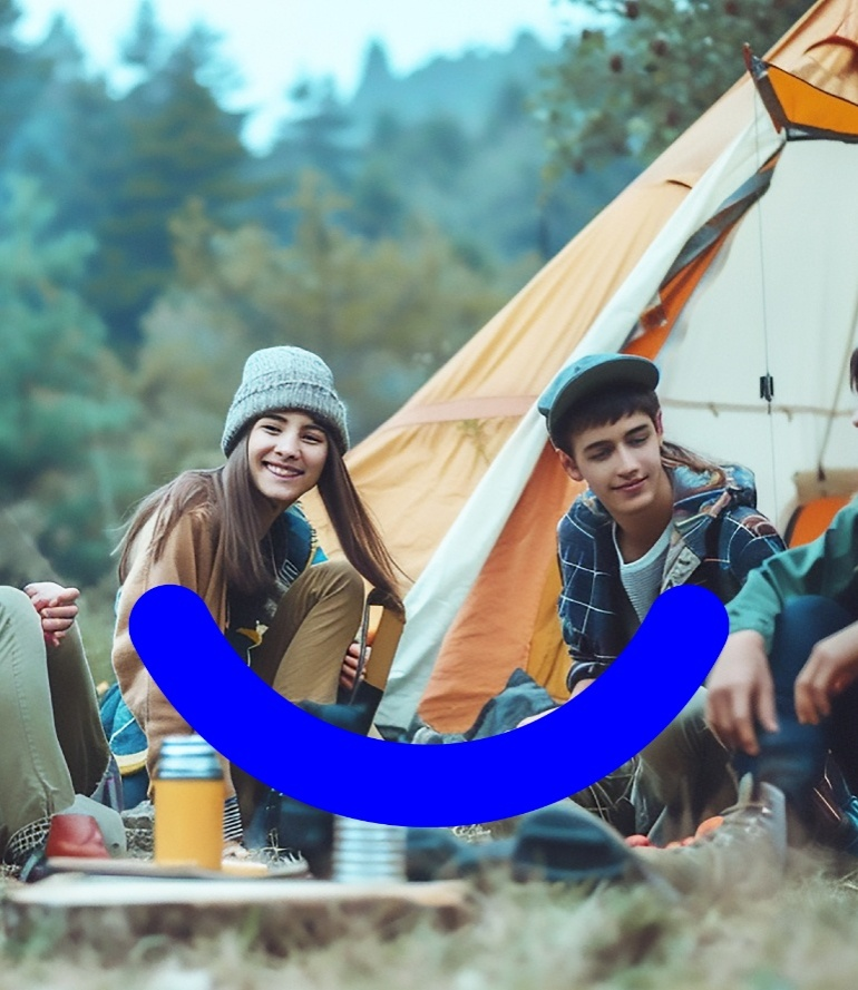 people sitting with each other in a camping area